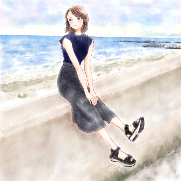 防波堤に腰掛ける女の子。
