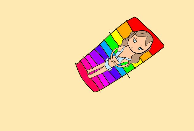 Girl on a rainbow beach towel at beach