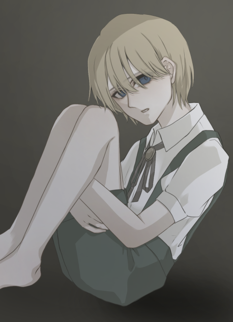 座る少年