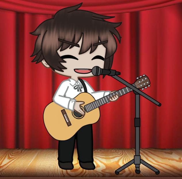 Spain plays acoustic guitar and sings