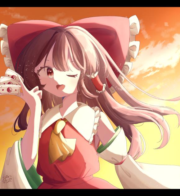夕焼けと巫女