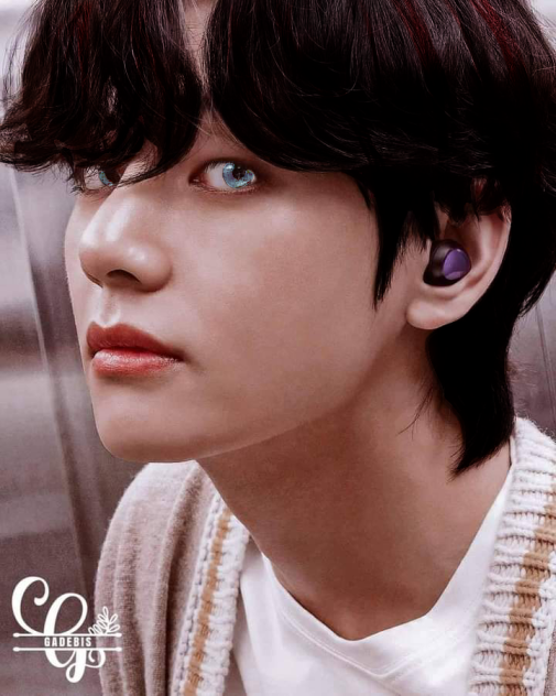 tae with brow hair and blue eyes